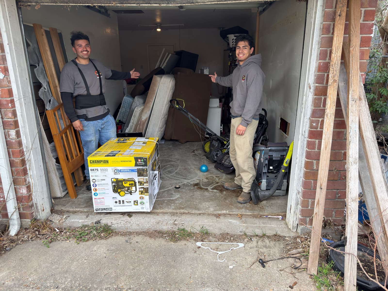 Cluttered Houston garage before a Junk Busters cleanout